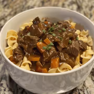 Crockpot Beef and Noodles taken with iphone 15 pro max --iw 2 --ar 4:5 --v 6.0 --raw