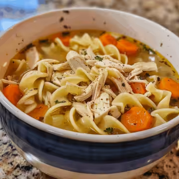 Crockpot Chicken Noodle Soup taken with iphone 15 pro max --iw 2 --ar 4:5 --v 6.0 --raw