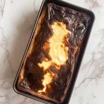 Burnt Basque Cheesecake In A Loaf Pan taken with iphone 15 pro max --iw 2 --ar 4:5 --v 6.1 --raw