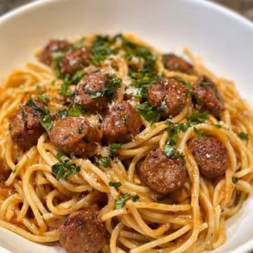 Cajun Sausage Pasta taken with iphone 15 pro max --iw 2 --ar 4:5 --v 6.1 --raw
