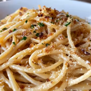 Caramelized Onion Pasta taken with iphone 15 pro max --iw 2 --ar 4:5 --v 6.1 --raw