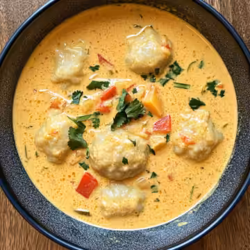 Coconut Curry Soup With Dumplings taken with iphone 15 pro max --iw 2 --ar 4:5 --v 6.1 --raw