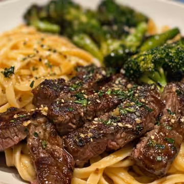 Cowboy Butter Steak Broccoli Linguine taken with iphone 15 pro max --iw 2 --ar 4:5 --v 6.1 --raw