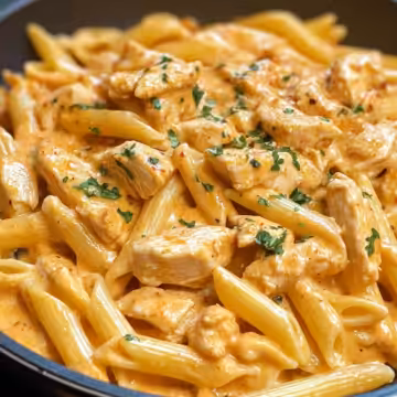 Creamy Cajun Chicken Pasta Recipe taken with iphone 15 pro max --iw 2 --ar 4:5 --v 6.1 --raw