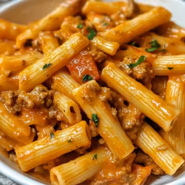 Creamy Tomato Garlic Pasta Recipe taken with iphone 15 pro max --iw 2 --ar 4:5 --v 6.1 --raw