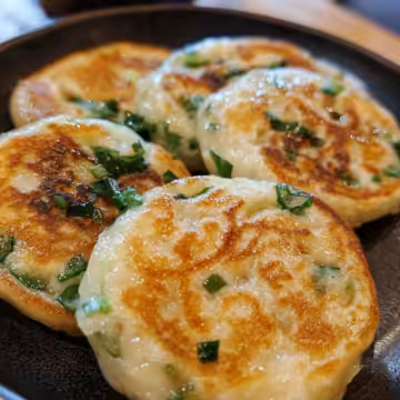Crispy Chinese Scallion Pancakes Cong You Bing taken with iphone 15 pro max --iw 2 --ar 4:5 --v 6.1 --raw