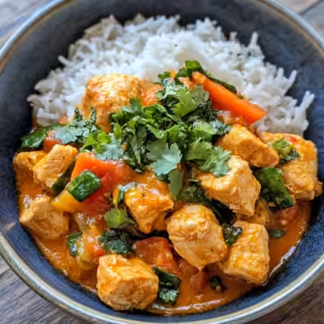 Easy Thai Red Curry Chicken taken with iphone 15 pro max --iw 2 --ar 4:5 --v 6.1 --raw