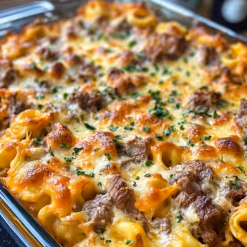 Golden Cheese Steak Tortellini Casserole Recipe taken with iphone 15 pro max --iw 2 --ar 4:5 --v 6.1 --raw