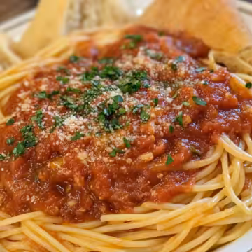 Homemade Spaghetti Sauce taken with iphone 15 pro max --iw 2 --ar 4:5 --v 6.1 --raw