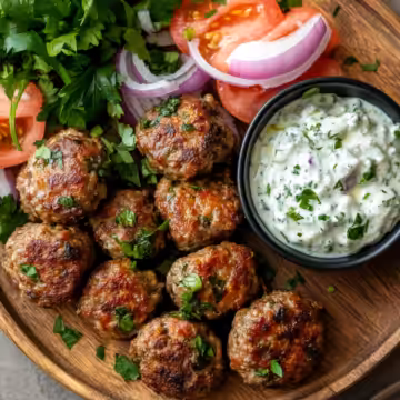 Irresistible Baked Greek Lentil Meatballs With Tzatziki taken with iphone 15 pro max --iw 2 --ar 4:5 --v 6.1 --raw