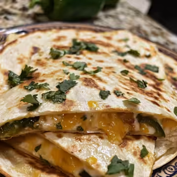 Jalapeno Popper Quesadillas taken with iphone 15 pro max --iw 2 --ar 4:5 --v 6.1 --raw