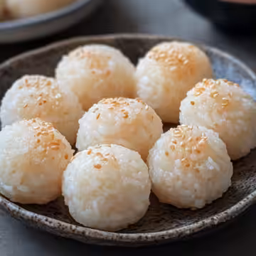 Korean Rice Balls taken with iphone 15 pro max --iw 2 --ar 4:5 --v 6.1 --raw
