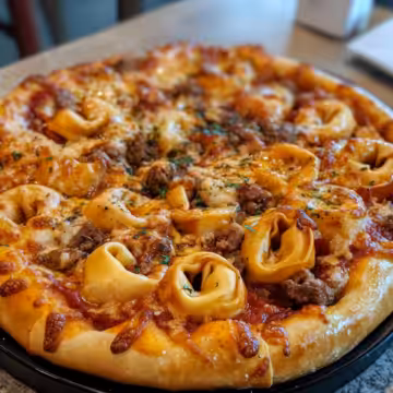 Meat Lovers Pizza Tortellini taken with iphone 15 pro max --iw 2 --ar 4:5 --v 6.1 --raw