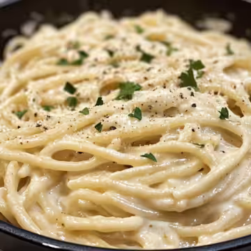 One Pot Creamy Garlic Pasta taken with iphone 15 pro max --iw 2 --ar 4:5 --v 6.1 --raw