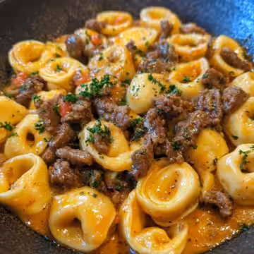 Philly Cheesesteak Tortellini Pasta taken with iphone 15 pro max --iw 2 --ar 4:5 --v 6.1 --raw
