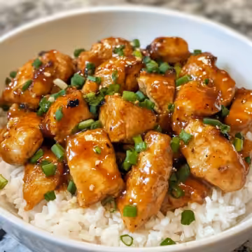 Spicy Maple Chicken With Coconut Rice taken with iphone 15 pro max --iw 2 --ar 4:5 --v 6.1 --raw