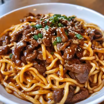 Sticky Beef Noodles taken with iphone 15 pro max --iw 2 --ar 4:5 --v 6.1 --raw