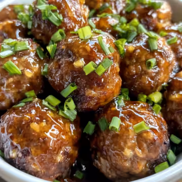 Sticky Honey Garlic Meatballs taken with iphone 15 pro max --iw 2 --ar 4:5 --v 6.1 --raw