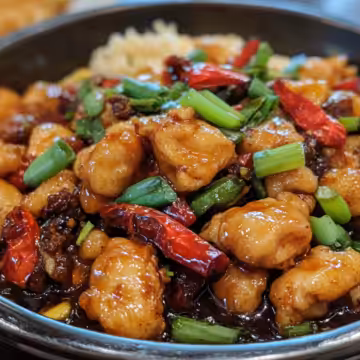 Szechuan Chicken taken with iphone 15 pro max --iw 2 --ar 4:5 --v 6.1 --raw