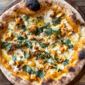 Thai Curry Pizza taken with iphone 15 pro max --iw 2 --ar 4:5 --v 6.1 --raw
