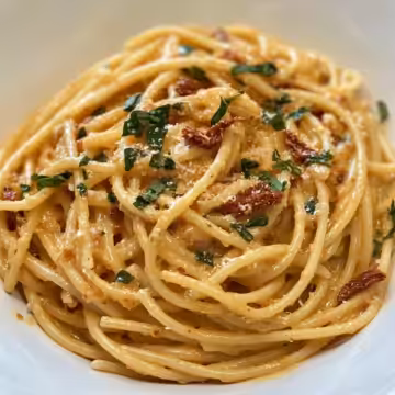 Vegan Creamy Sun Dried Tomato Pasta Recipe taken with iphone 15 pro max --iw 2 --ar 4:5 --v 6.1 --raw