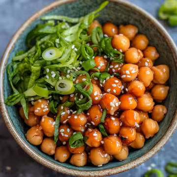 Vegan Sticky Sesame Chickpeas Recipe taken with iphone 15 pro max --iw 2 --ar 4:5 --v 6.1 --raw