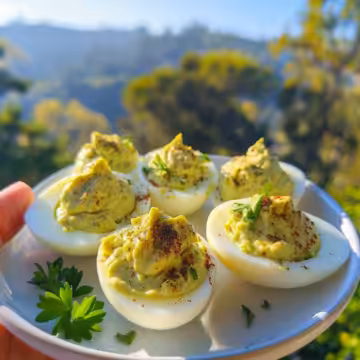 Avocado Deviled Eggs taken with iphone 15 pro max --iw 2 --ar 4:5 --v 6.0 --raw