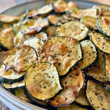 Best Crunchy Zucchini Chips taken with iphone 15 pro max --iw 2 --ar 4:5 --v 6.0 --raw