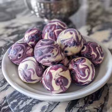 Blueberry Swirl Yogurt Bites taken with iphone 15 pro max --iw 2 --ar 4:5 --v 6.0 --raw