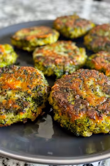 Broccoli Cheese Patties taken with iphone 15 pro max --iw 2 --ar 4:5 --v 6.0 --raw