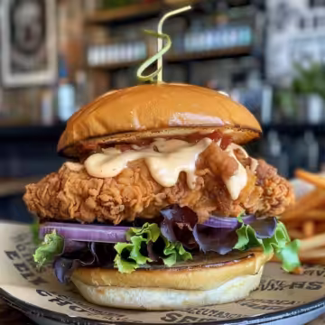 Cajun Crispy Chicken Sandwich with Garlic Aioli taken with iphone 15 pro max --iw 2 --ar 4:5 --v 6.0 --raw
