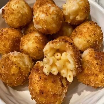 Cheesecake Factory Air Fryer Fried Macaroni and Cheese Balls taken with iphone 15 pro max --iw 2 --ar 4:5 --v 6.0 --raw