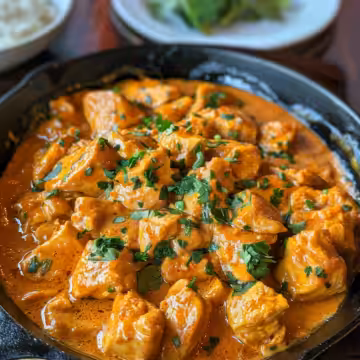 Copycat Texas Roadhouse Butter Chicken Skillet taken with iphone 15 pro max --iw 2 --ar 4:5 --v 6.0 --raw