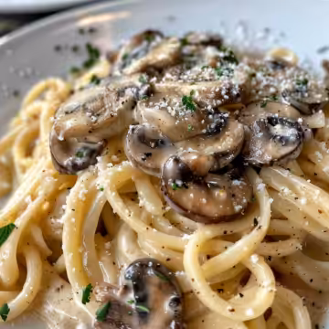 Cozy Tuscan Mushroom Pasta taken with iphone 15 pro max --iw 2 --ar 4:5 --v 6.0 --raw