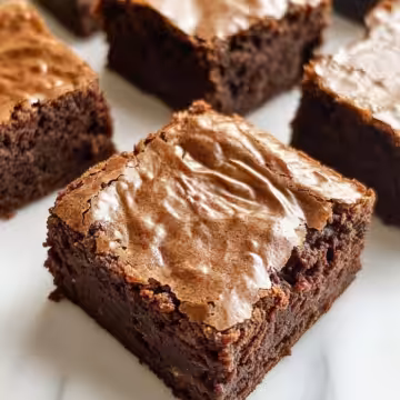 Craving These Flourless Greek Yogurt Brownies taken with iphone 15 pro max --iw 2 --ar 4:5 --v 6.1 --raw
