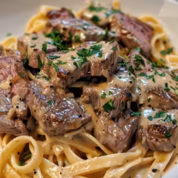 Creamy Garlic Butter Steak Pasta taken with iphone 15 pro max --iw 2 --ar 4:5 --v 6.0 --raw