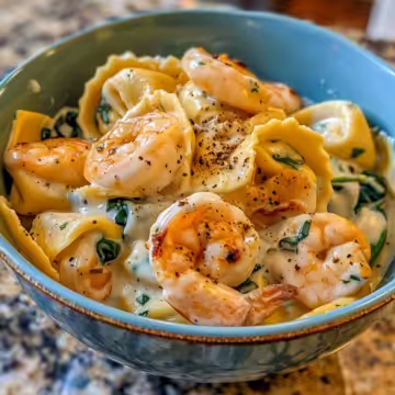 Creamy Shrimp and Spinach Tortellini taken with iphone 15 pro max --iw 2 --ar 4:5 --v 6.0 --raw
