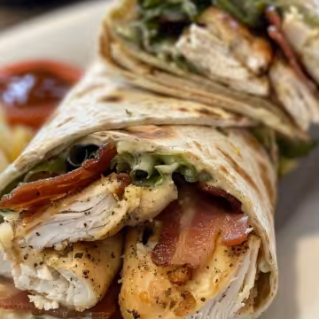 Crispy Chicken Bacon Ranch Wrap taken with iphone 15 pro max --iw 2 --ar 4:5 --v 6.0 --raw