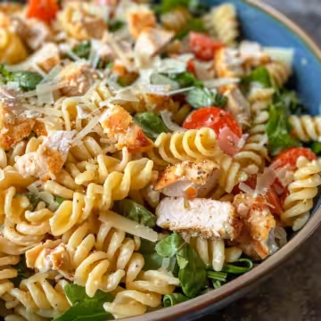 Easy Chicken Caesar Pasta Salad taken with iphone 15 pro max --iw 2 --ar 4:5 --v 6.0 --raw
