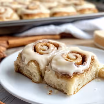 Fluffy Banana Bread Cinnamon Rolls with Cream Cheese Frosting taken with iphone 15 pro max --iw 2 --ar 4:5 --v 6.1 --raw