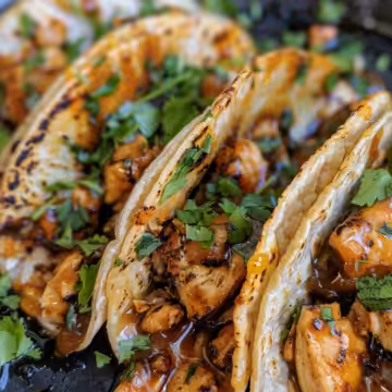 Garlic Butter Honey BBQ Chicken Tacos taken with iphone 15 pro max --iw 2 --ar 4:5 --v 6.0 --raw