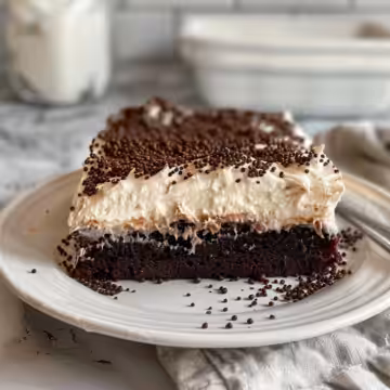 Irish Cream Poke Cake taken with iphone 15 pro max --iw 2 --ar 4:5 --v 6.0 --raw