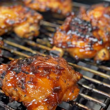 Juicy Japanese BBQ Chicken Thighs taken with iphone 15 pro max --iw 2 --ar 4:5 --v 6.0 --raw