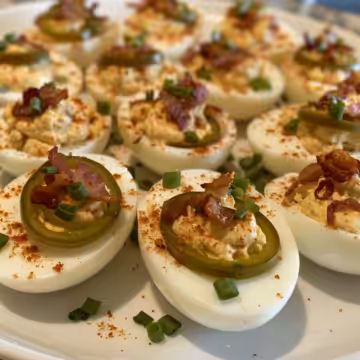 Loaded Jalapeño Popper Deviled Eggs with Bacon taken with iphone 15 pro max --iw 2 --ar 4:5 --v 6.0 --raw