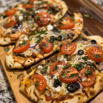 Mediterranean Naan Bread Pizza taken with iphone 15 pro max --iw 2 --ar 4:5 --v 6.0 --raw