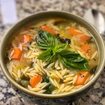 Mediterranean Orzo Soup taken with iphone 15 pro max --iw 2 --ar 4:5 --v 6.0 --raw