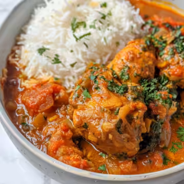 Nigerian Chicken Stew taken with iphone 15 pro max --iw 2 --ar 4:5 --v 6.0 --raw