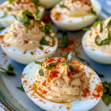 Spanish Deviled Eggs taken with iphone 15 pro max --iw 2 --ar 4:5 --v 6.0 --raw