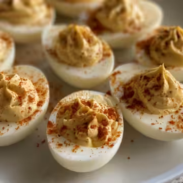 Spicy Banana Pepper Deviled Eggs taken with iphone 15 pro max --iw 2 --ar 4:5 --v 6.0 --raw