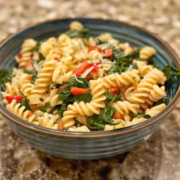Spinach Dip Pasta Salad taken with iphone 15 pro max --iw 2 --ar 4:5 --v 6.0 --raw